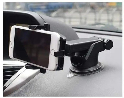 Phone holder on a car dashboard with a blurred background