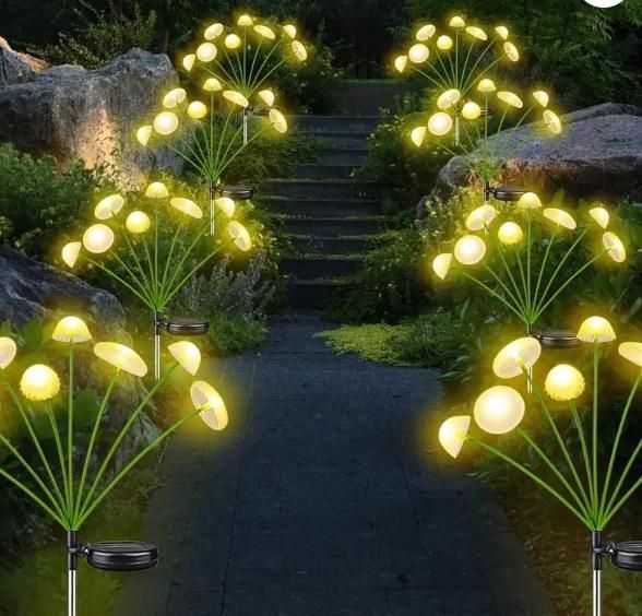 Solar garden lights in a garden setting with rocks and steps.