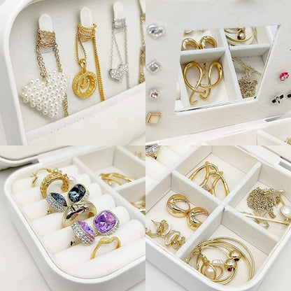 Jewelry set including rings, necklaces, and earrings displayed in a white jewelry box.